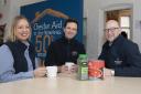 Laura Griffiths and David Roberts, right, of Harlech Foodservice with Chester Aid To The Homeless Chief Executive Robert Whittall at their hub on Grosvenor Street. Picture: Mandy Jones.