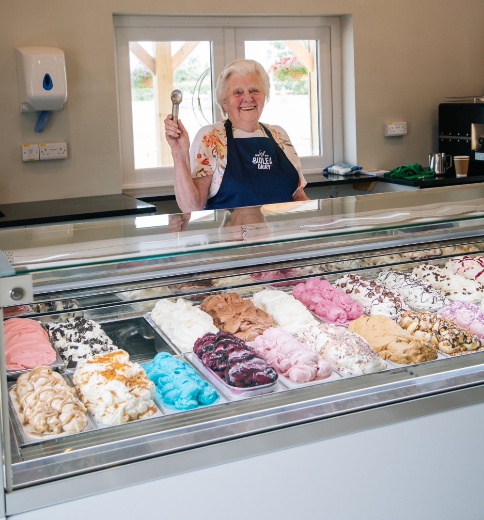 Adams nan Betty with some of the 24 varieties of ice cream in the dairy shop