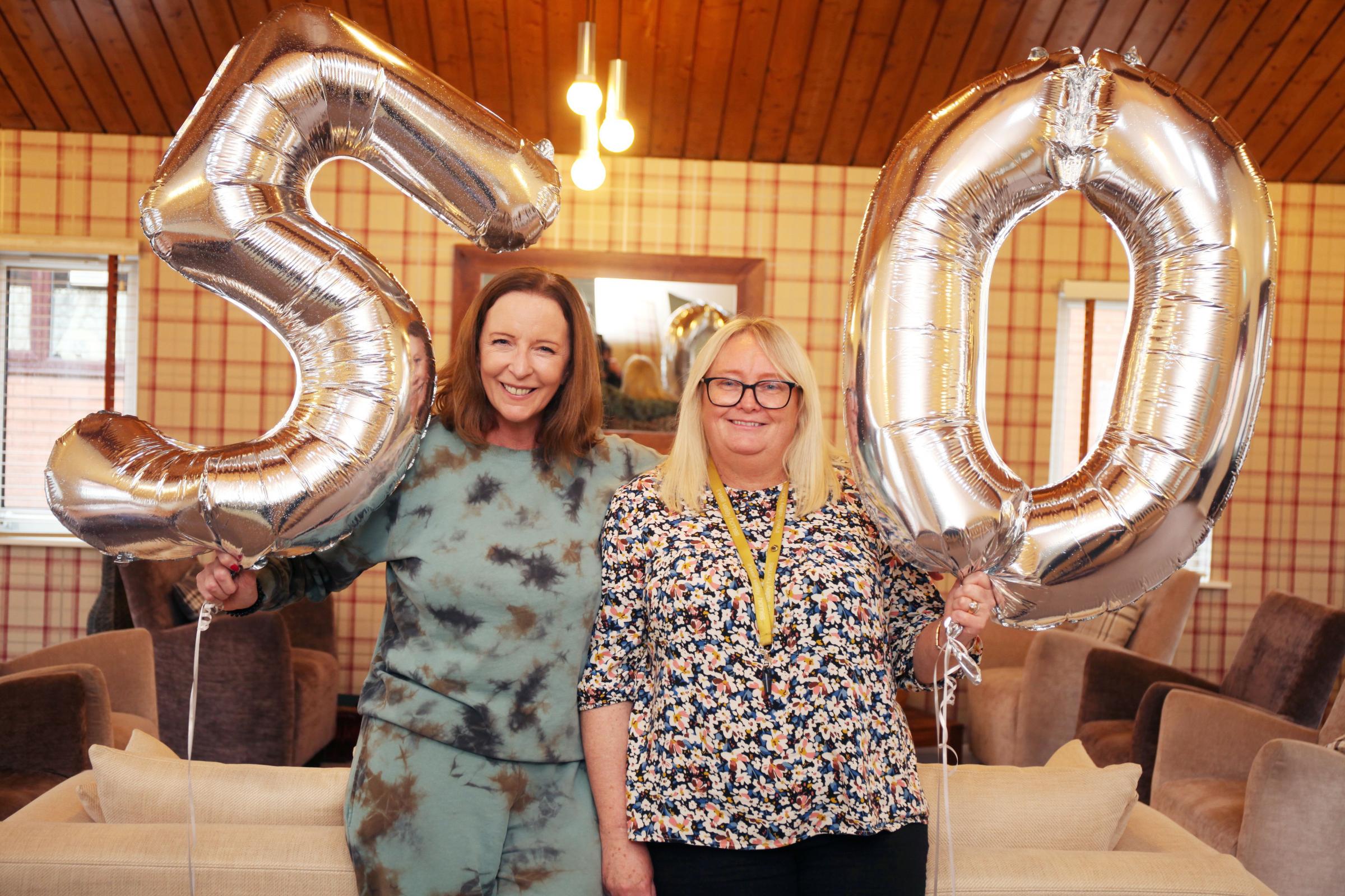 Jeni Williams and Catherine Gorman, independent living manager at Irwell Valley Homes, celebrate the organisation’s 50th birthday