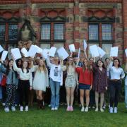 Celebrating success, a group of sixth form girls excited for their next chapter.