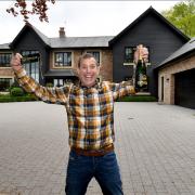 Omaze Cheshire winner Kevin Bryant outside his new 3.5 million home