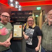 That Beer Place receiving their certificate.
