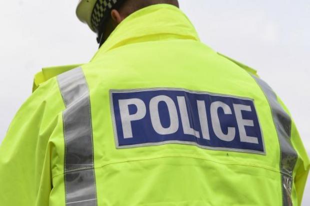 Police have charged a man over a series of offensive 999 calls.