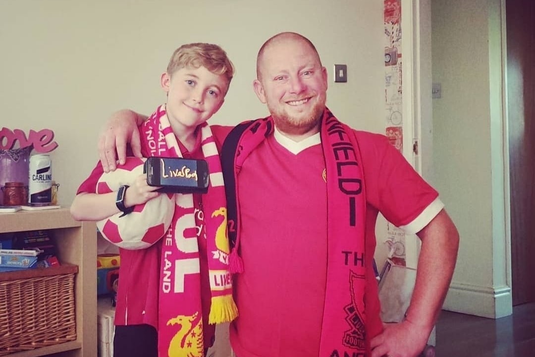 Football-loving, Liverpool FC fan Karl Rae with his son.