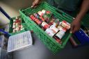 File photo dated 05/10/18 of food being sorted at a food bank. Emergency food parcels handed out to children in Scotland rose by more than a fifth last summer, new figures indicate..