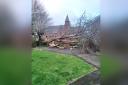 The fallen tree has damaged the cenotaph outside Christ Church, Ellesmere Port. Picture by Leigh & Company Stationers.
