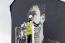 Work being carried out on the mural.