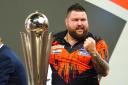 Michael Smith is not ready to give up his title as world champion just yet (Zac Goodwin/PA)