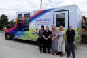 Council Leader and Cabinet Member for Wellbeing, Cllr Louise Gittins, with staff from the Council’s Library Service and the new electric mobile library vehicle.