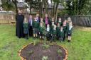 (L-R) Father Mark, Cllr Wheeler, Justin Madders MP and Bishop of Chester Mark Tanner visit the Spiritual Garden with pupils from Little Sutton C of E Primary.