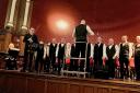 Violinist Philip Chidell performs with Chester Male Voice Choir at Chester Town Hall.