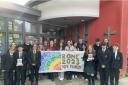 Students who contributed to the banner for Pope Francis stand proudly with Chaplin Ana Gasparini (centre) outside Catholic High School Chester in Handbridge.