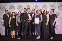 Sykes Holiday Cottages accept their award from the British Travel Awards.