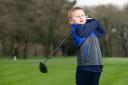 George Hughes, 7, playing golf at Wigan Golf Club at Arley Hall, Blockrod. A budding golfer is on course to raise £100,000 for charity by playing a round in five different countries in under 24 hours in memory of his late father.