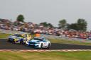 Ash Sutton and Jake Hill fight for victory at the Kwik Fit British Touring Car Championship round.