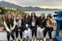 A group of girls admire the view from Nerja.