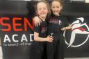 Up-and-coming kickboxing talent Alan Fagan, right, with her sister Carys