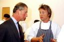Charles talks to Jamie Oliver in the kitchen of Clarence House in 2003 (John Stillwell/PA)