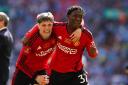 Alejandro Garnacho and Kobbie Mainoo celebrate after Manchester United's victory in the FA Cup