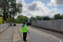 A PCSO in a keep clear zone outside a school.