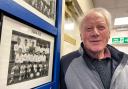 Dennis Reeves beside his photo outside the Chester FC Legends Lounge. Photo by Ian Cooper.