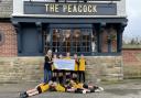 The Chester Nomads Zebras U11's team being presented with a cheque for £750 by Rachel Gerrard from the Peacock Hotel.