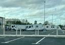 Traveller caravans and towing vehicles on Junction Nine Retail Park