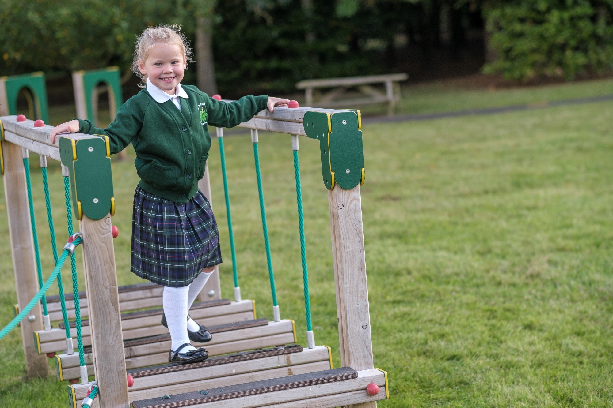 A pupil at Little Sutton C of E Primary School shows off the new school uniform on the trim trail.