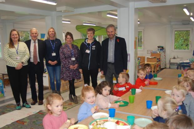 Clare Riley Early Years Practitioner; John Brimelow Trustee, The Ursula Keyes' Trust; Emma Foster Deputy Manager; Jeanette Jolliffe Manager; Chris Barrowcliff Administrator; Ian Russell Trustee, The Ursula Keyes' Trust with pupils.