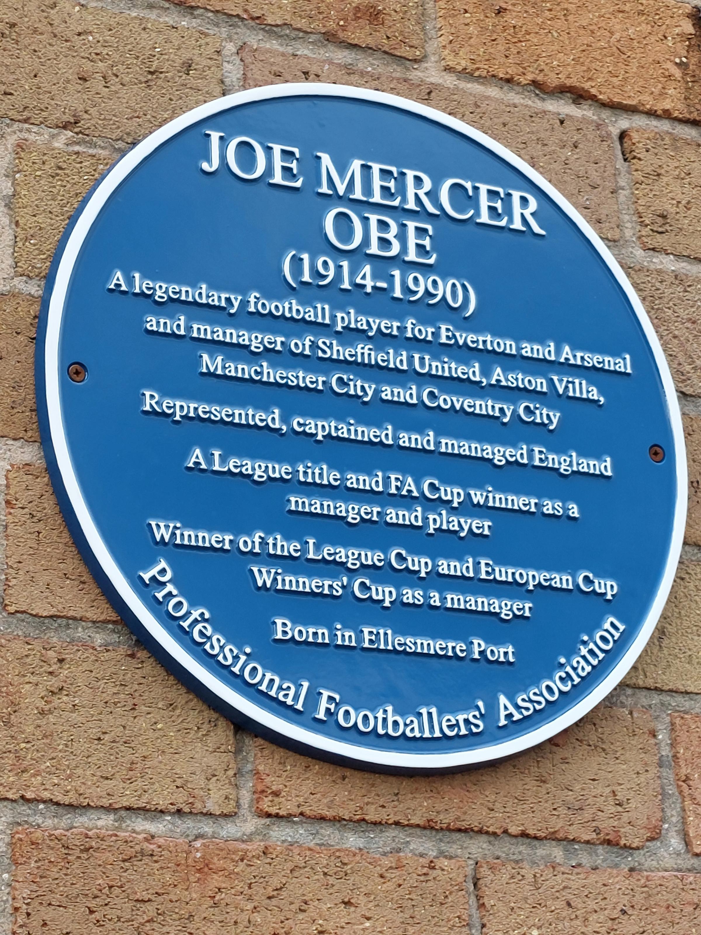 The blue plaque honouring footballing great Joe Mercer at Ellesmere Port Civic Hall.
