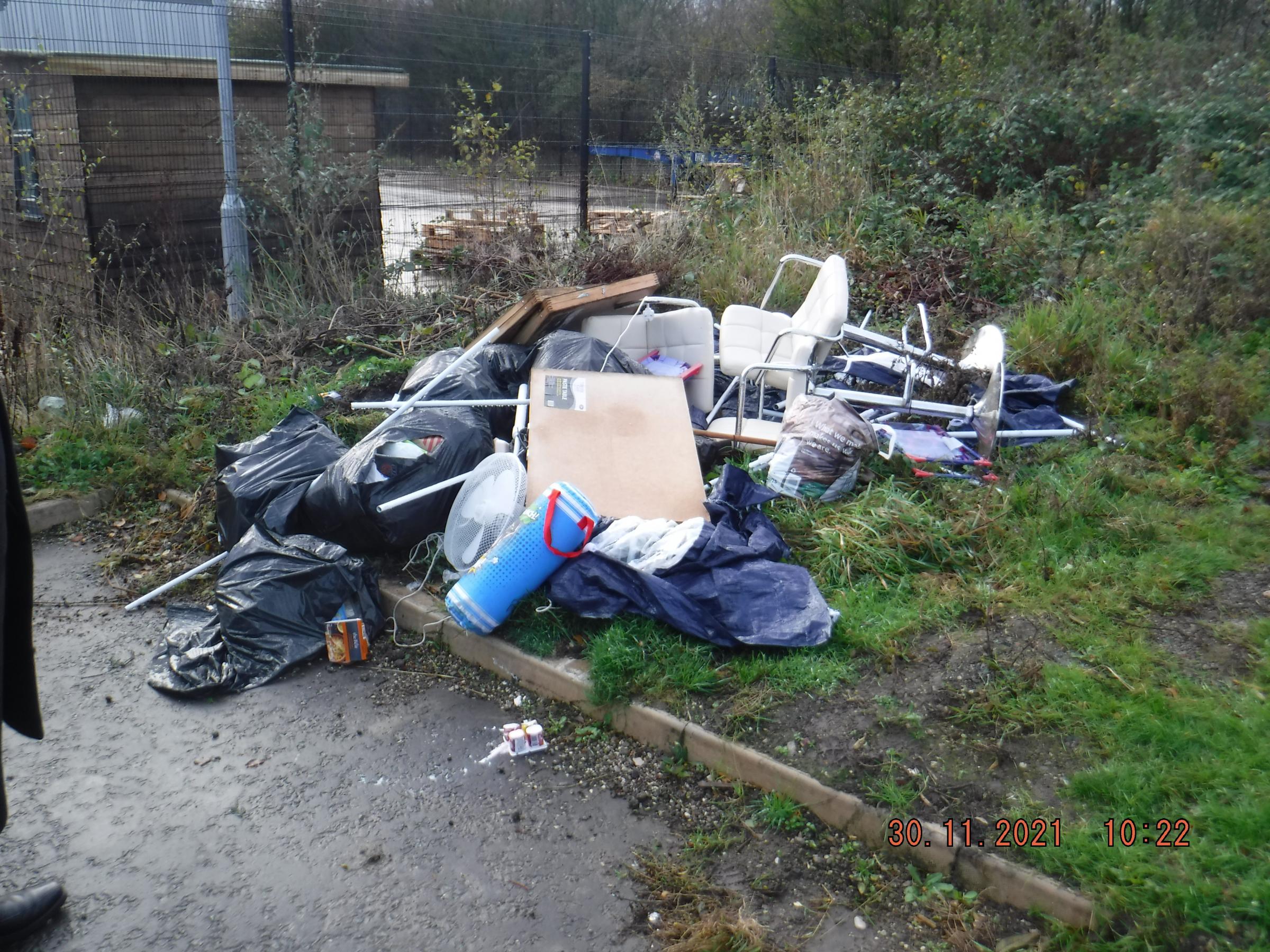 Fly-tipping in Ellesmere Port, where an electric fan, a punch bag and chairs were among the litter.