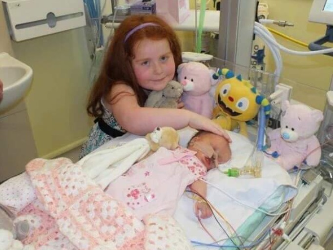 Jess Weaver at Alder Hey with baby sister Georgie, who sadly died aged five days old.