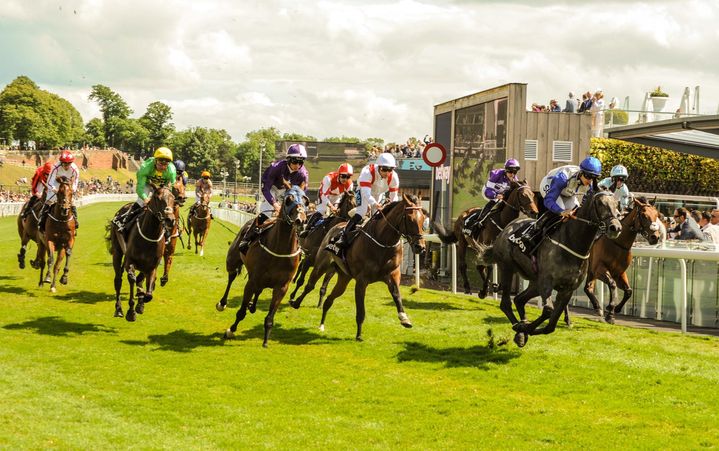 Chester Racecourse, Edinburgh Gin Summer Saturday. Picture Fourth race of the day, The Extra Places Every Day At Betway Handicap Stakes (Class 2) winner No 1 Outgate and jockey Richard Kingscote, second place No 11 Thunder Legend. All pictures: Simon