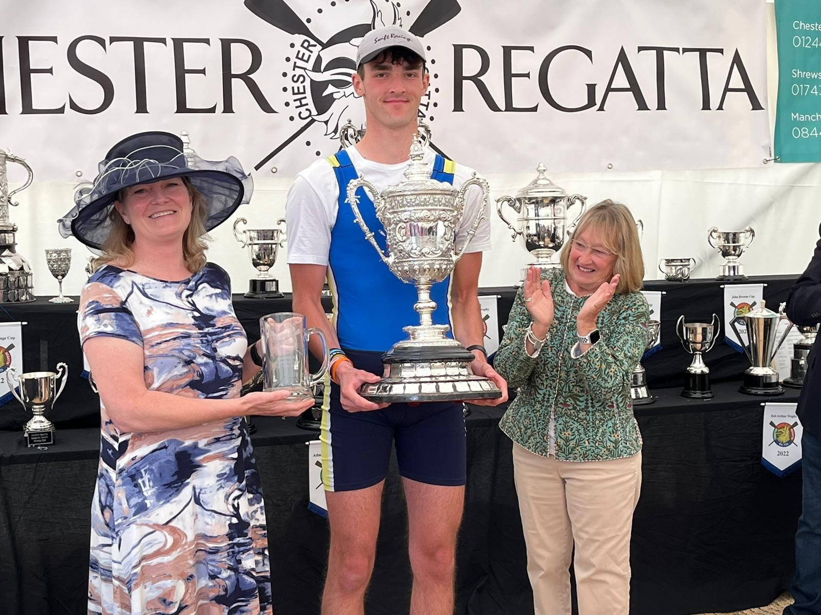 Champion of the Dee Op 1x James Cox Warrington RC with Regatta Secretary Jan Chillery of Aaron & Partners and Vice president Jenny Lloyd.