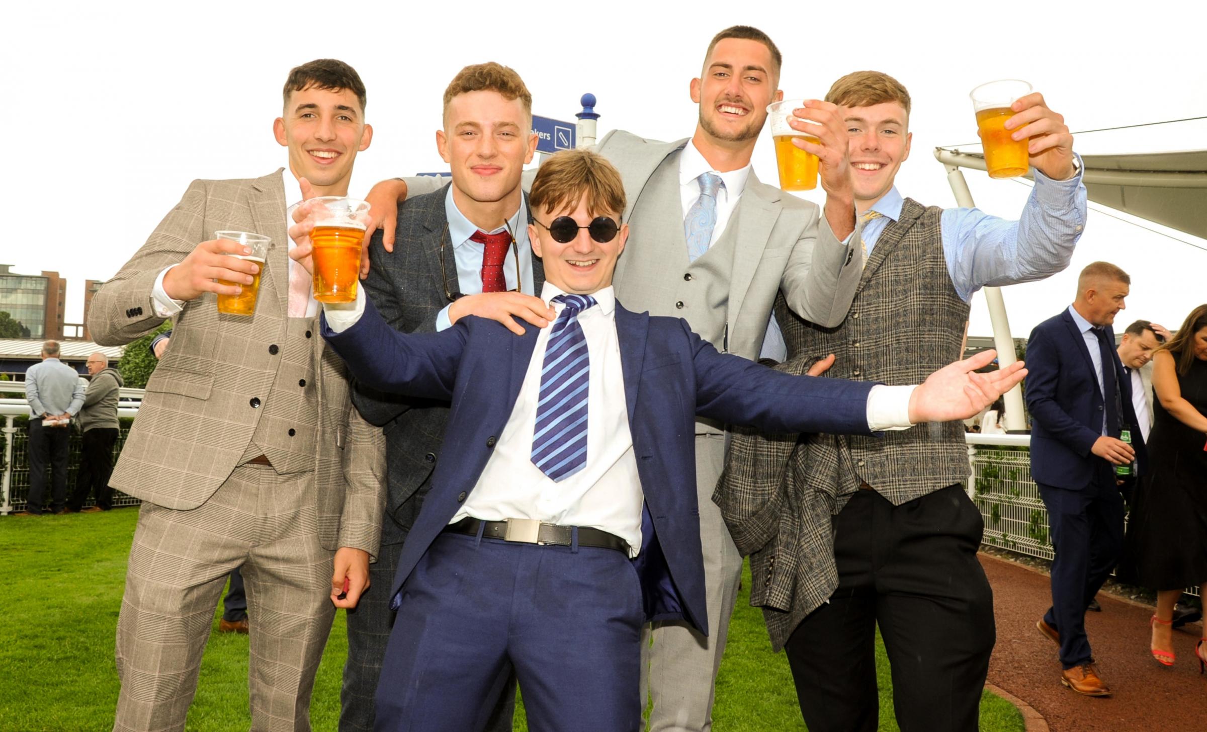 Chester Racecourse, Matthew Clark Summer Festival. Picture centre Mike Greave with friends enjoying the day. SW2562022.