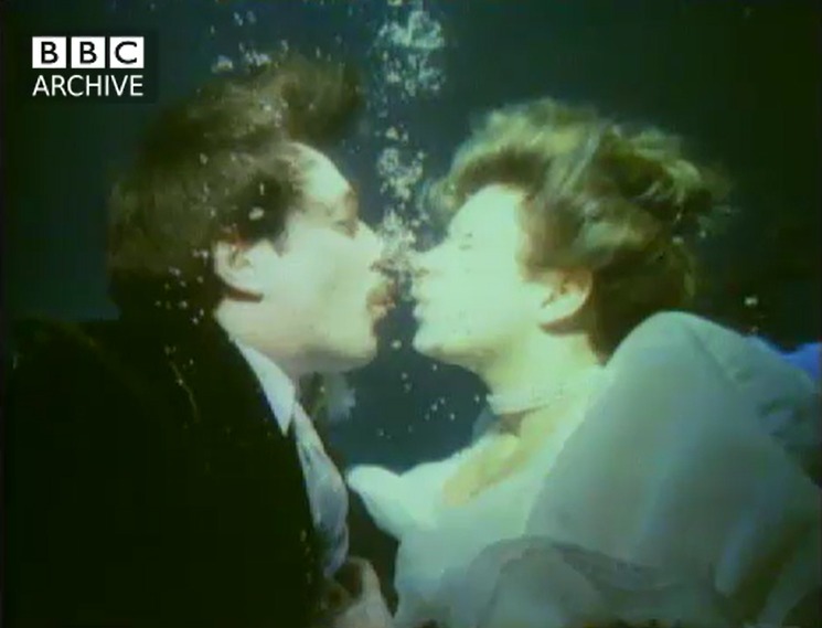 Geoff Oldfield and Hazel Dalby, together with their wedding guests, celebrated their marriage with a ceremony at their local swimming pool in Ellesmere Port Leisure Centre in 1986. Picture: BBC Archive.