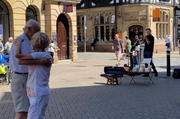 A couple who danced to Philip Chidell's violin on Eastgate Street have wowed viewers on social media.