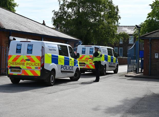 Chester and District Standard: A convoy of police vehicles leaving Wilmslow Police Station as part of Operation Cicero