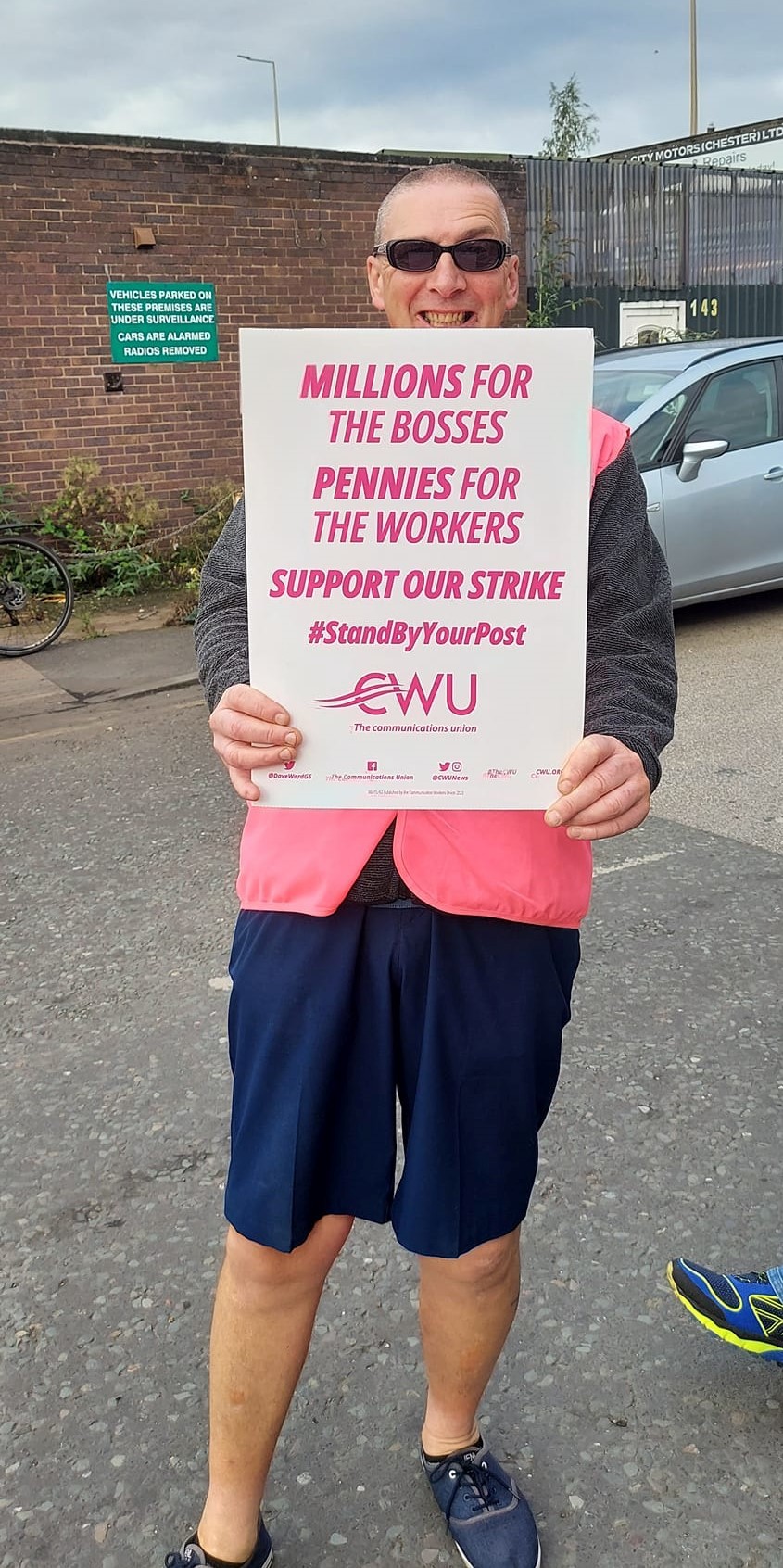 CWU members strike for a better pay deal.  Pictured is a CWU member on the Hoole Bridge Delivery Office picket line.  Photo by Felicity Dowling.