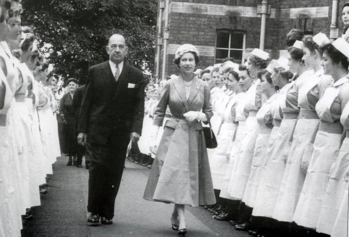 Colonel CW Marsden walks with Queen Elizabeth II during the visit to the Royal Infirmary of Her Majesty and the Duke of Edinburgh to Chester in July 1957.
