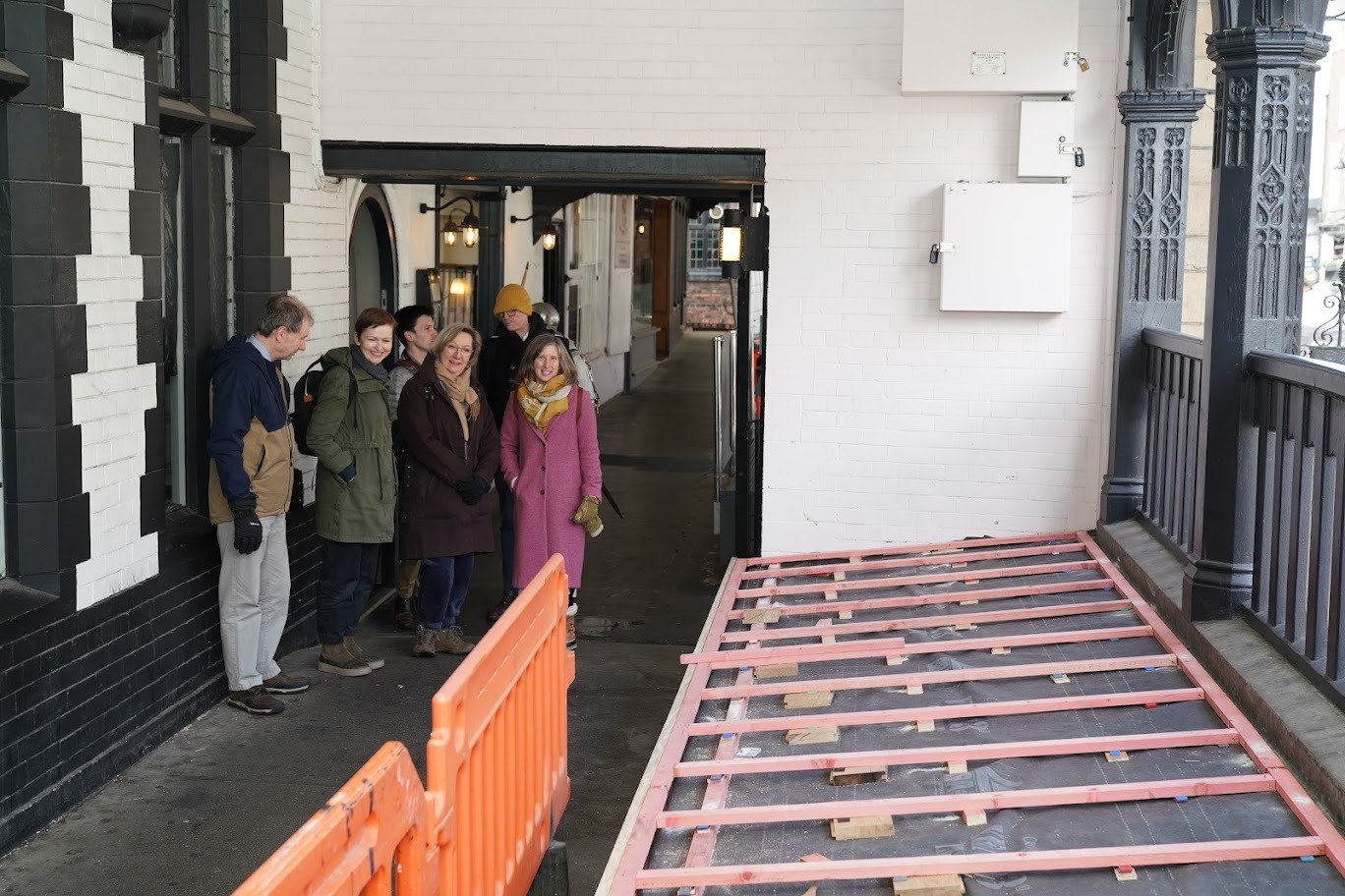 The tour looking at improvements being made to the rows walkway area with the timber flooring and balustrade.