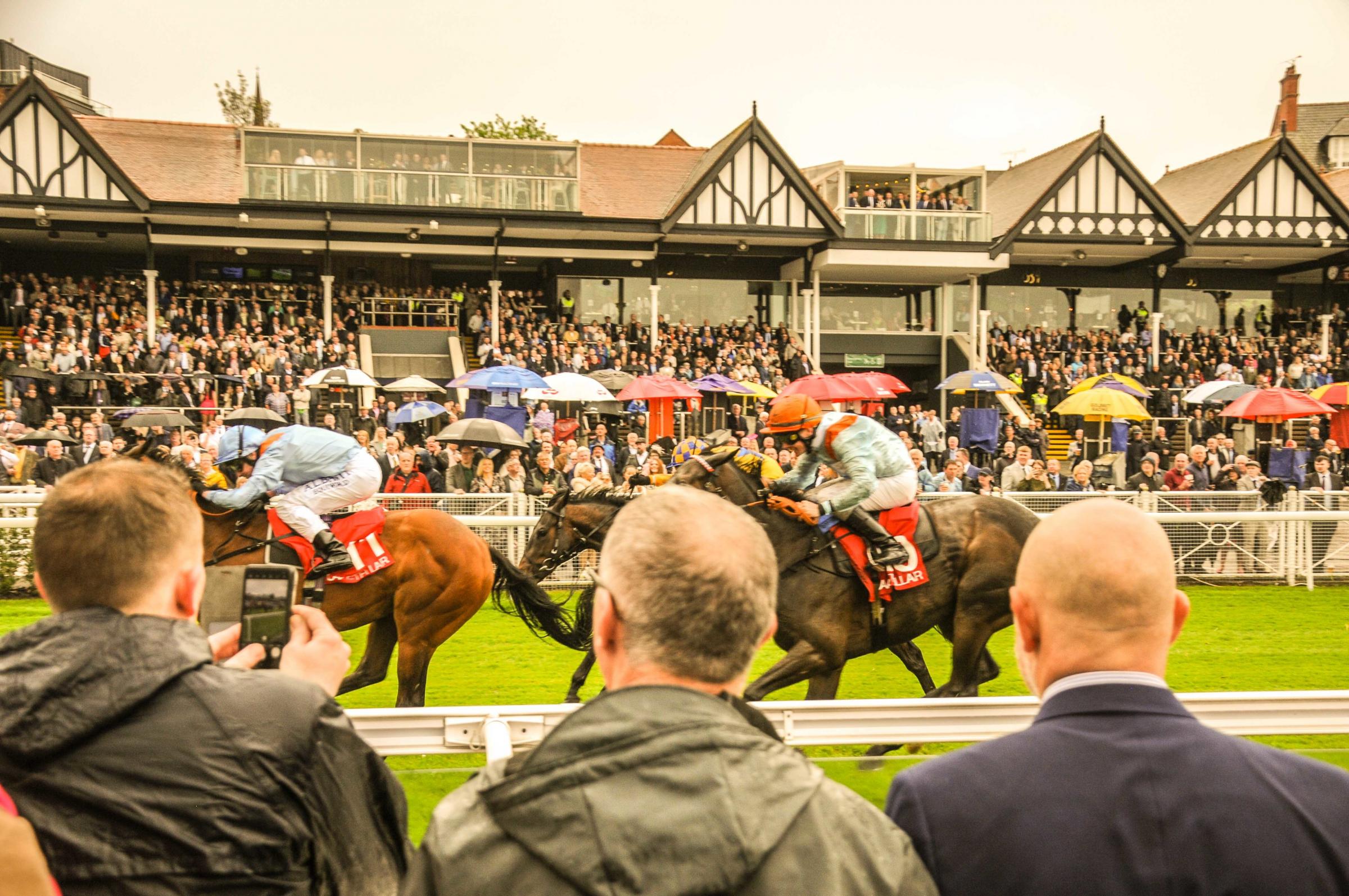 Chester Racecourse, Boodles May Festival City Day. Picture The CAA Stellar Lily Agnes Conditions Stakes (Class 2) Race from the crowds. SW1052023.