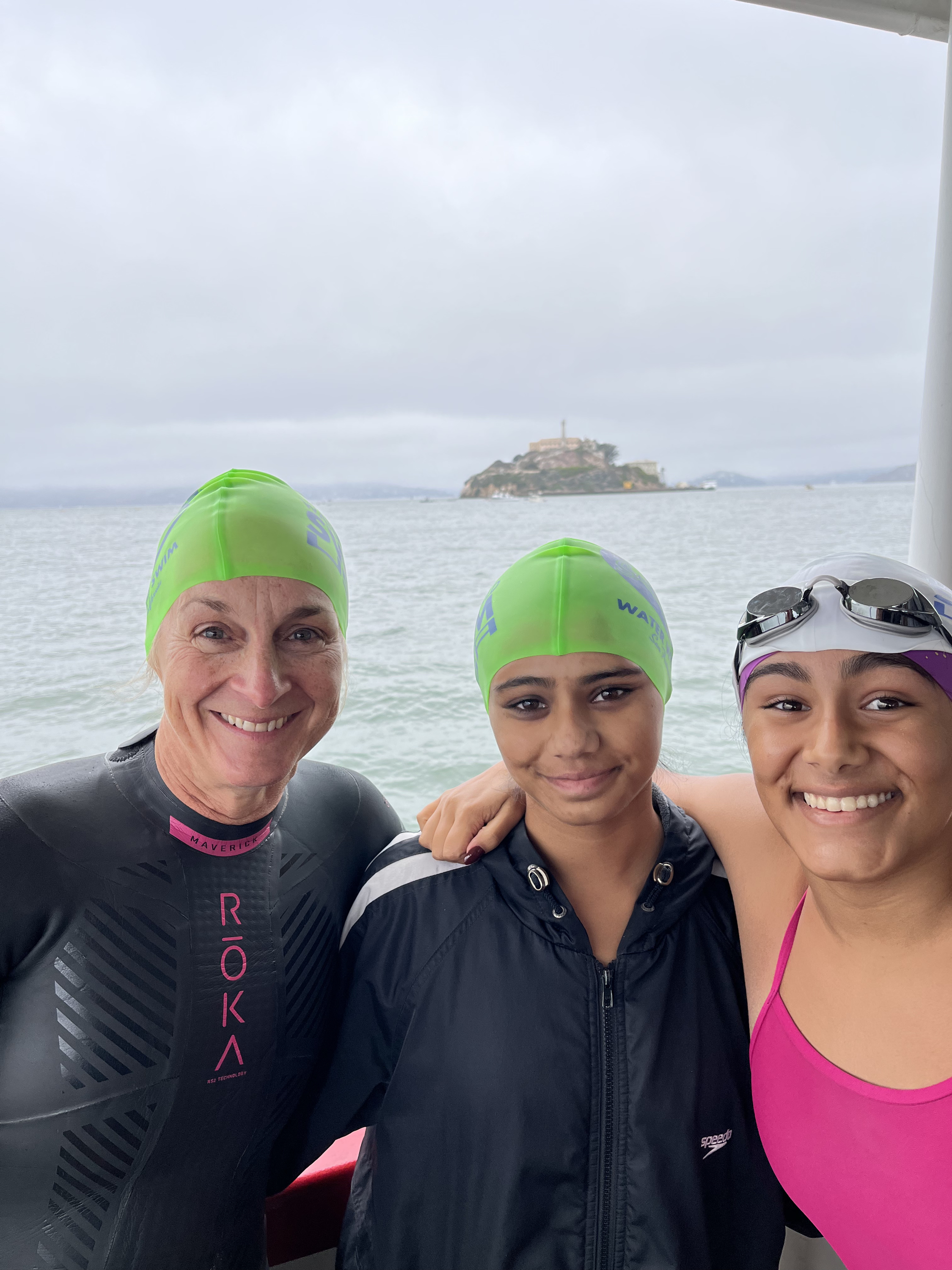 Louise Minchin swimming off Alcatraz with Anaya and Mitali Khanzode.