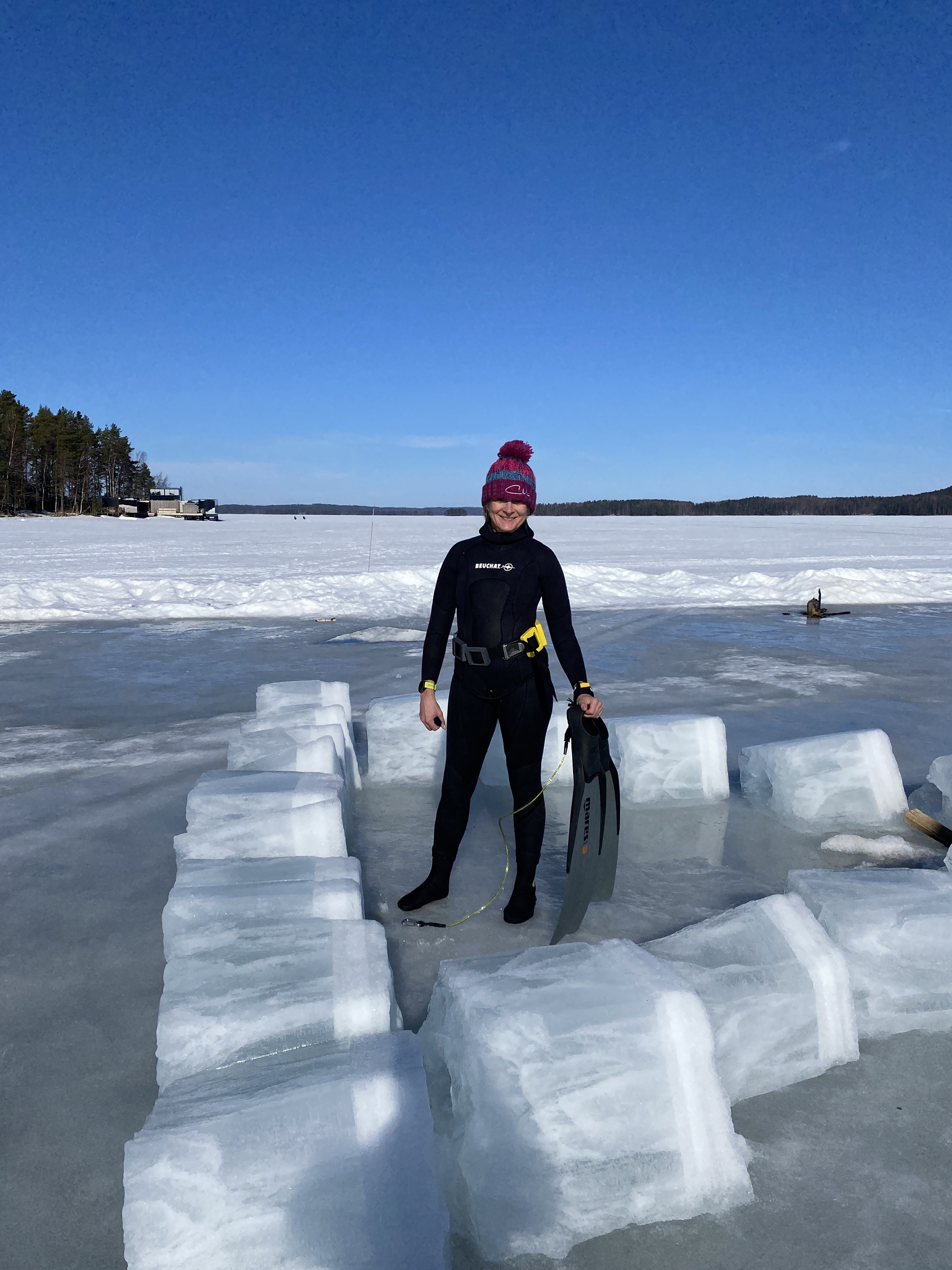 Louise Minchin free-diving under ice in Finland.