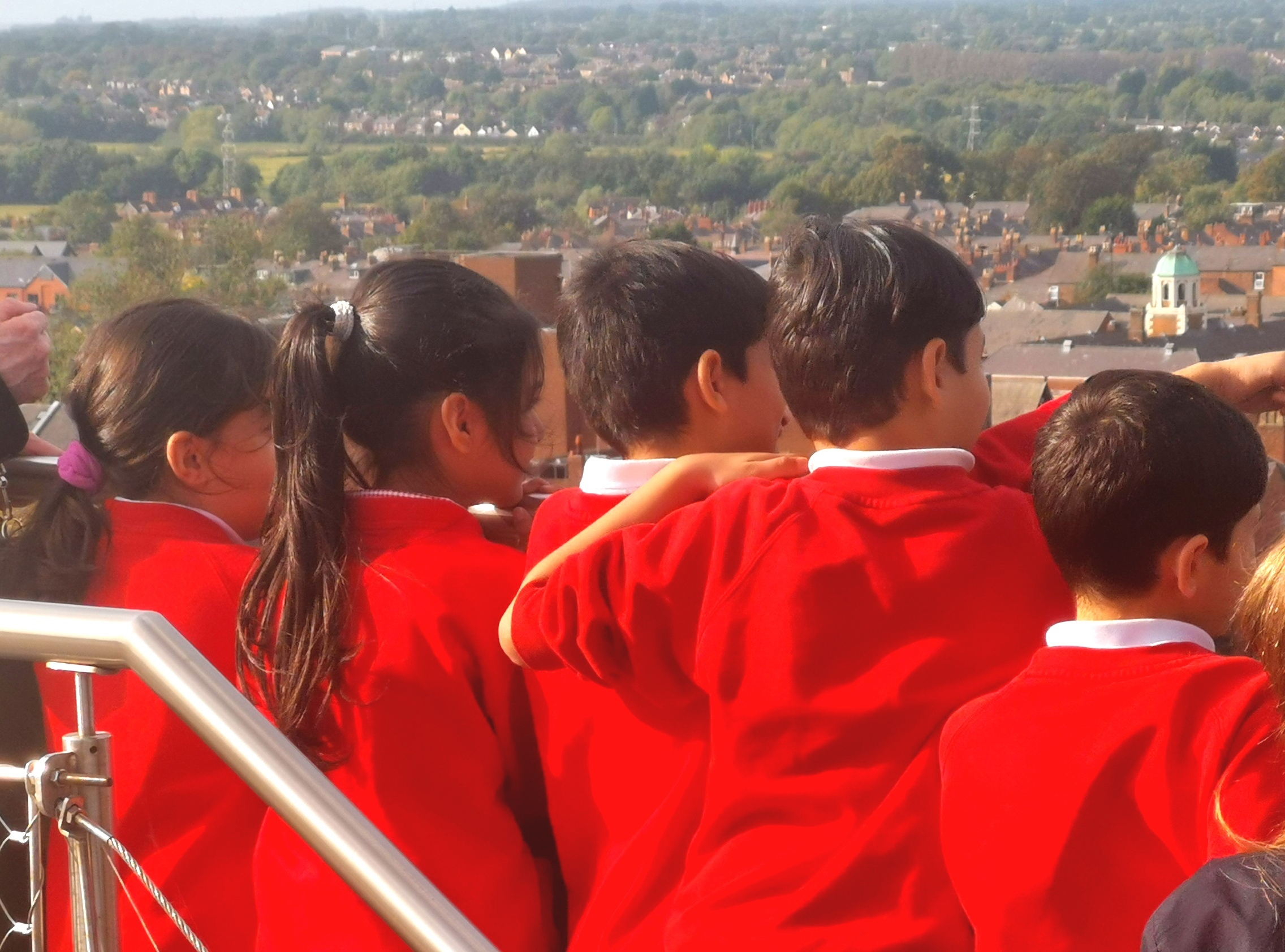 The Afghan children look out from the top of Chester Cathedral tower to see if they can work out where home is.