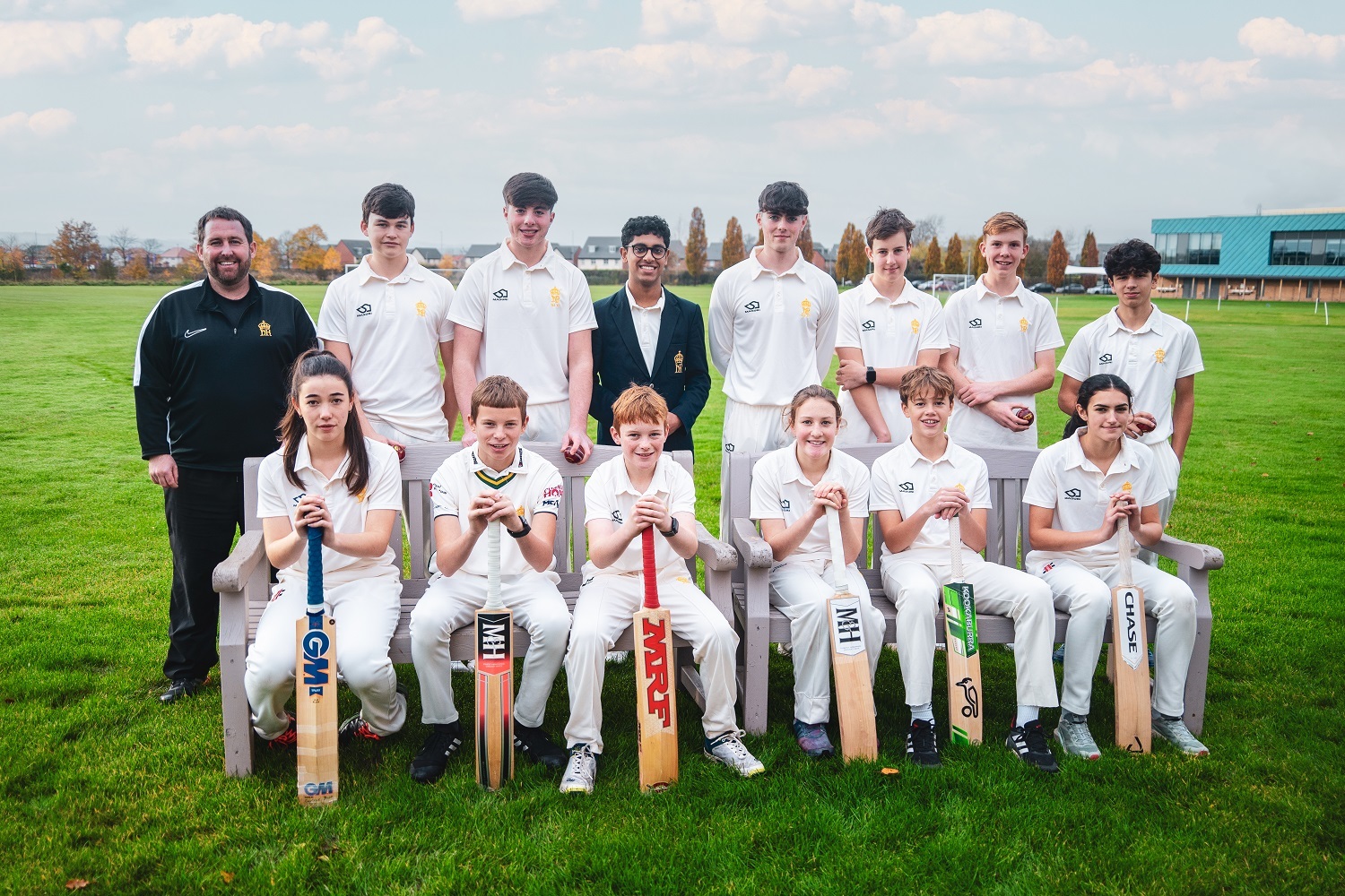 King’s cricketers celebrate their success with director of cricket, Mark Baker.