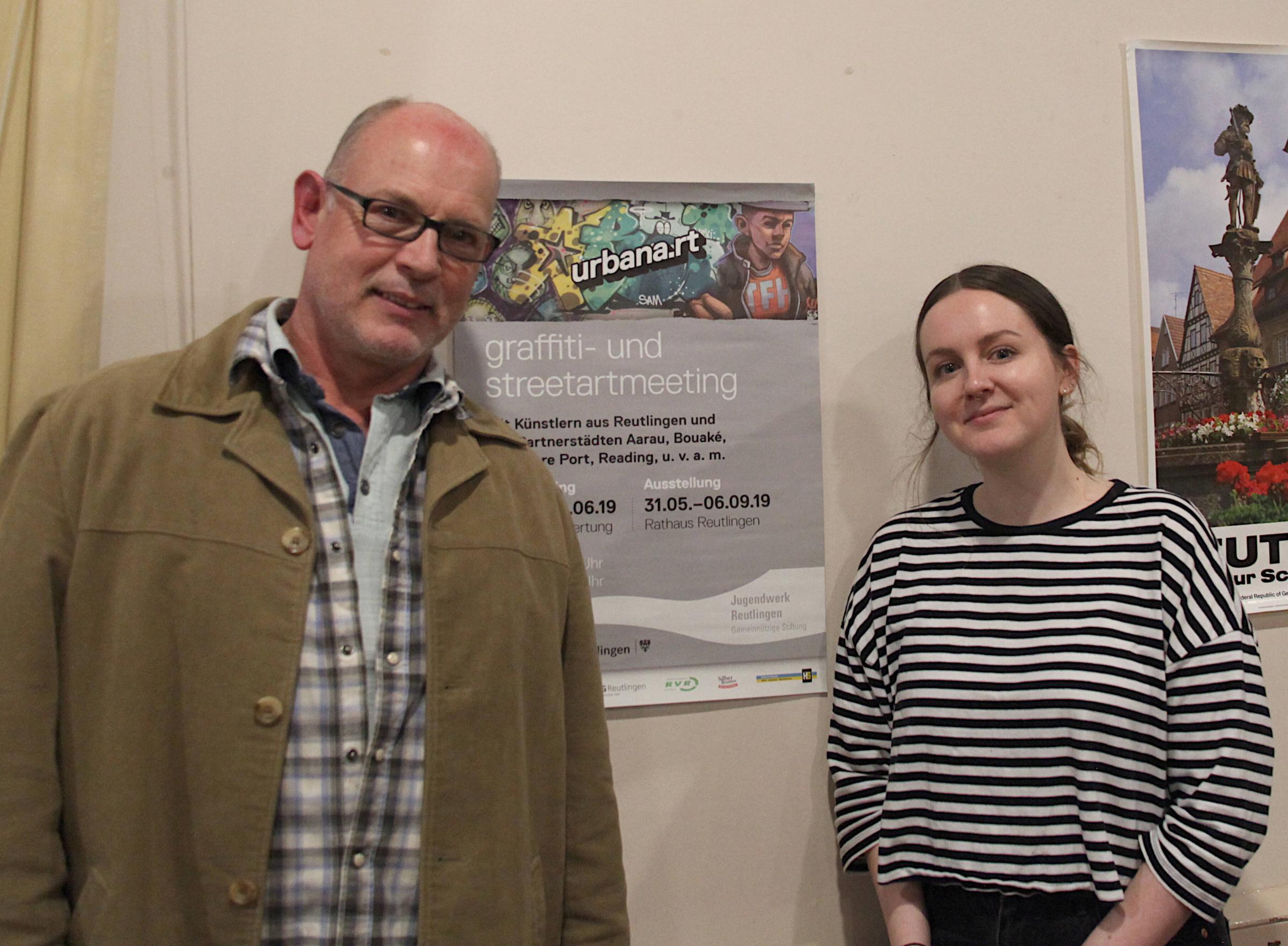 Ian Prewitt and Rachael Roberts, lecturers in art Cheshire College, looking at a poster depicting graffiti art painted by college student on a recent trip to Reutingen. 