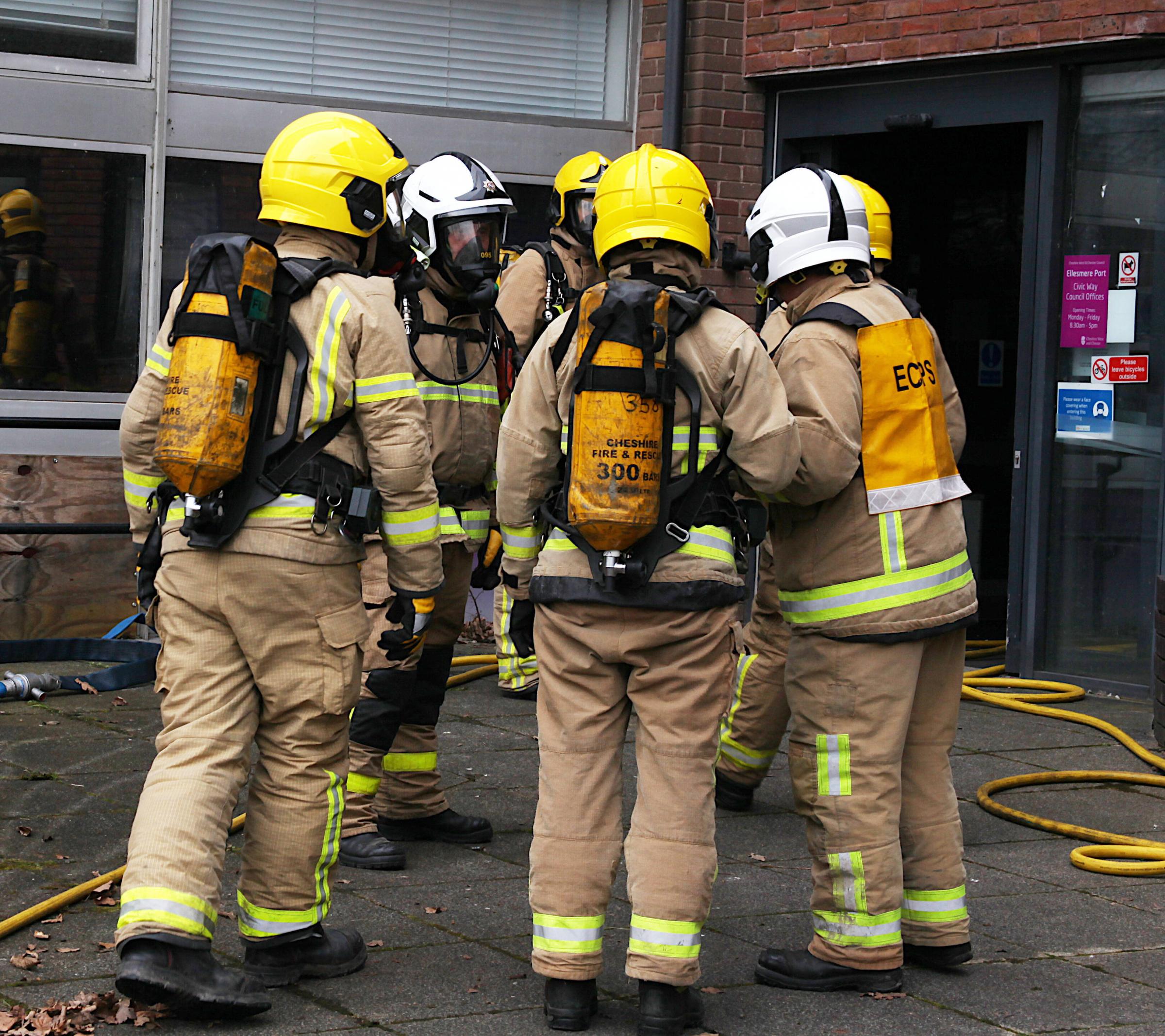 Firefighters are briefed about the hazards they can expect to find inside the building. Picture: Tom Ormiston.