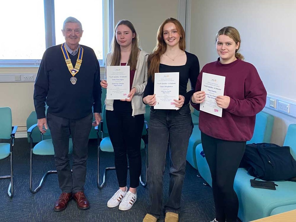 Rotary Club of Chester President, Stephen Cross presents certificates to Upton High Schools winning Senior Debating Team from Year 12. Lto R Emily Gascoigne, Claire Stringfellow and Daisy Kepista.