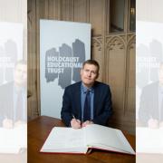 Mr Madders signing the Holocaust Educational Trust’s Book of Commitment.